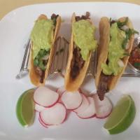 Bistec Hard Shell Tacos · Grilled beef.