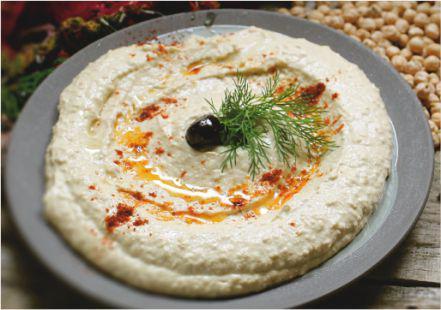 Hummus · A rich chickpeas and tahini paste, prepared with milk, garlic, lemon juice, and olive oil.