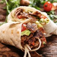 Mix Doner Wrap · Mix gyro. Comes with lettuce, tomato, onion, & garlic sauce