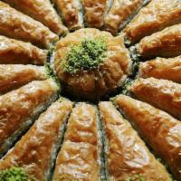 Baklava and Kinds · Sweet pastry made of extremely thin sheets of filo dough layered with chopped nuts and honey...
