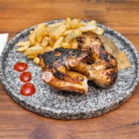 Grilled Peruvian Chicken  · 1/2 grilled chicken seasoned to the bone, you enjoy the techniques that make the humility an...