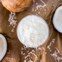 Large Coconut Smoothies · Tropical coconut blended with ice, milk and real coconut flakes.