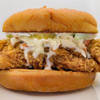 Fried Chicken Slaw Sandwich · Buttered toasted bun, fried chicken, coleslaw, mayo, pickles.