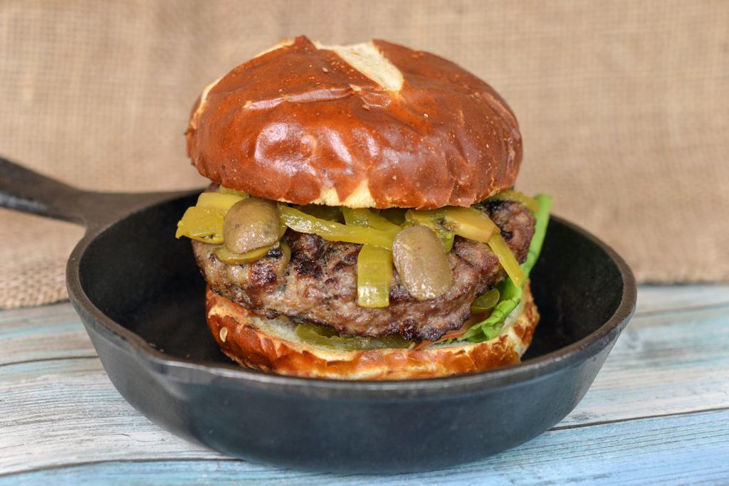 The Hot One Burger · Jalapeno peppers, grilled mushrooms, lettuce, tomato and spicy mayo. Our 100% fresh (never frozen) antibiotic, grass-fed beef perfectly grilled and served on a delicious pretzel bun.