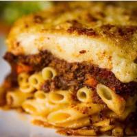 Pastichio  · Pasta and seasoned meat sauce topped with bechamel cream sauce. 