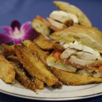 Grilled Chicken Pesto Panini · Grilled sliced chicken, fresh mozzarella, roasted tomatoes and basil pesto on toasted ciabat...