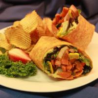 Veggie Wrap · Grilled seasonal vegetable mix with lettuce, tomato and hummus on a wrap of your choice.