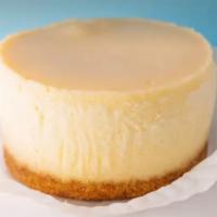 Personal NY Cheesecake · A rich, dense cheesecake, exploding with vanilla flavor. Sitting on a buttery graham cracker.