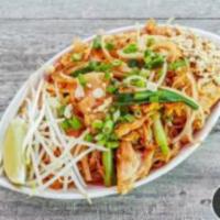 Pad Thai · Thin rice noodle, green onion, bean sprout, and egg, served with crushed peanut and lime wed...