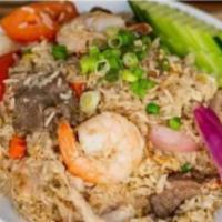 Kua Thai Fried Rice · Fried jasmine rice, shrimp, beef, pork, egg, carrot, green onion, tomato, peas, and cucumber.