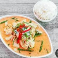 Panang Curry · Green beans, Panang curry paste topped with coconut cream, red bell pepper, and shredded kaf...