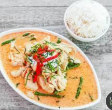 Panang Curry · Green beans, Panang curry paste topped with coconut cream, red bell pepper, and shredded kaffir lime leaves.