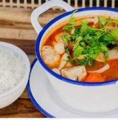 Tom Yum · A famous Thai hot and sour soup, mushroom aromantic, Thai herbs, roasted chili paste, and cilantro.