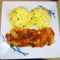 Eggs Benedict  · Two poached eggs on English muffin with Canadian Bacon and Hollandaise sauce served with Hom...