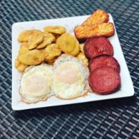 Tostones, salami, queso , huevo. · Fried green plantains, fried cheese , salami and eggs any style.