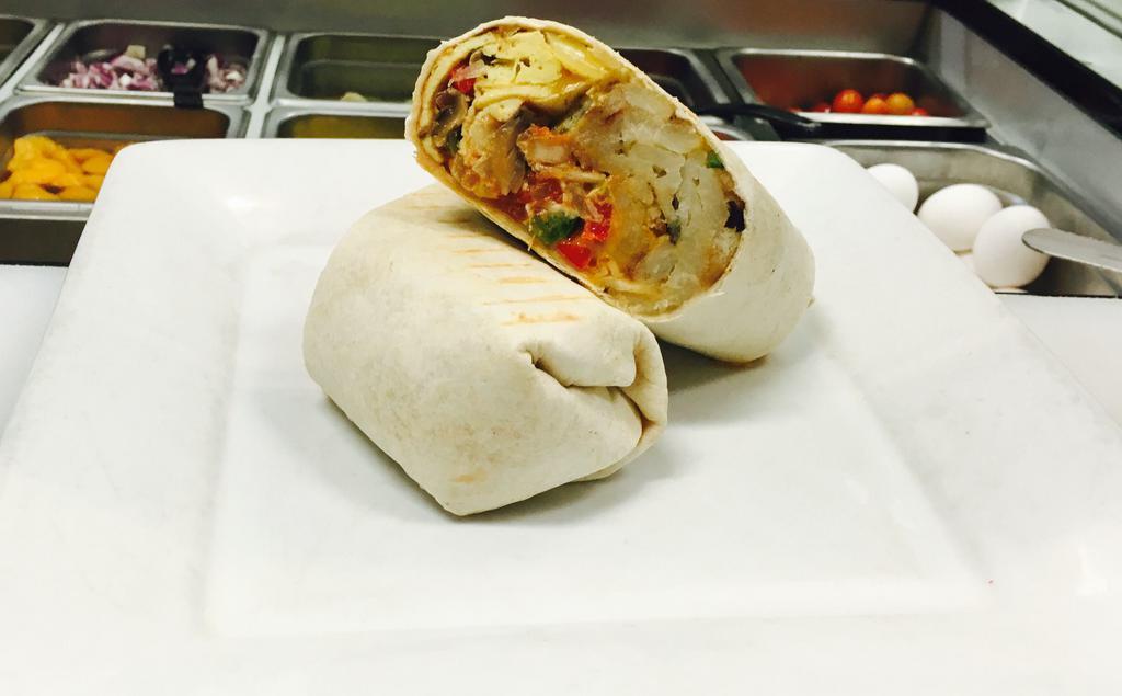 Breakfast Burrito · 2 eggs omelette with bacon or sausages, mixed cheese and home fries wrapped in a flour tortilla.
