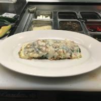 Go Brolic Omelette · Made with sliced turkey, spinach, onions, peppers and Swiss cheese.