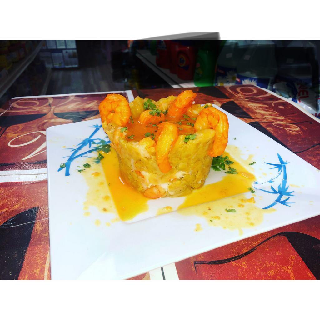 Shrimp Mofongo (Camarofongo) · Mashed green plantains mixed with Shrimps in garlic sauce , served with Shrimps on top and gravy on the side.