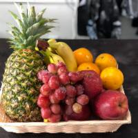 Basket 1 · 1 pineapple, 2 lb. bananas, 4 red apple, 1 lb. grapes, 6 oranges and 6 kiwis.