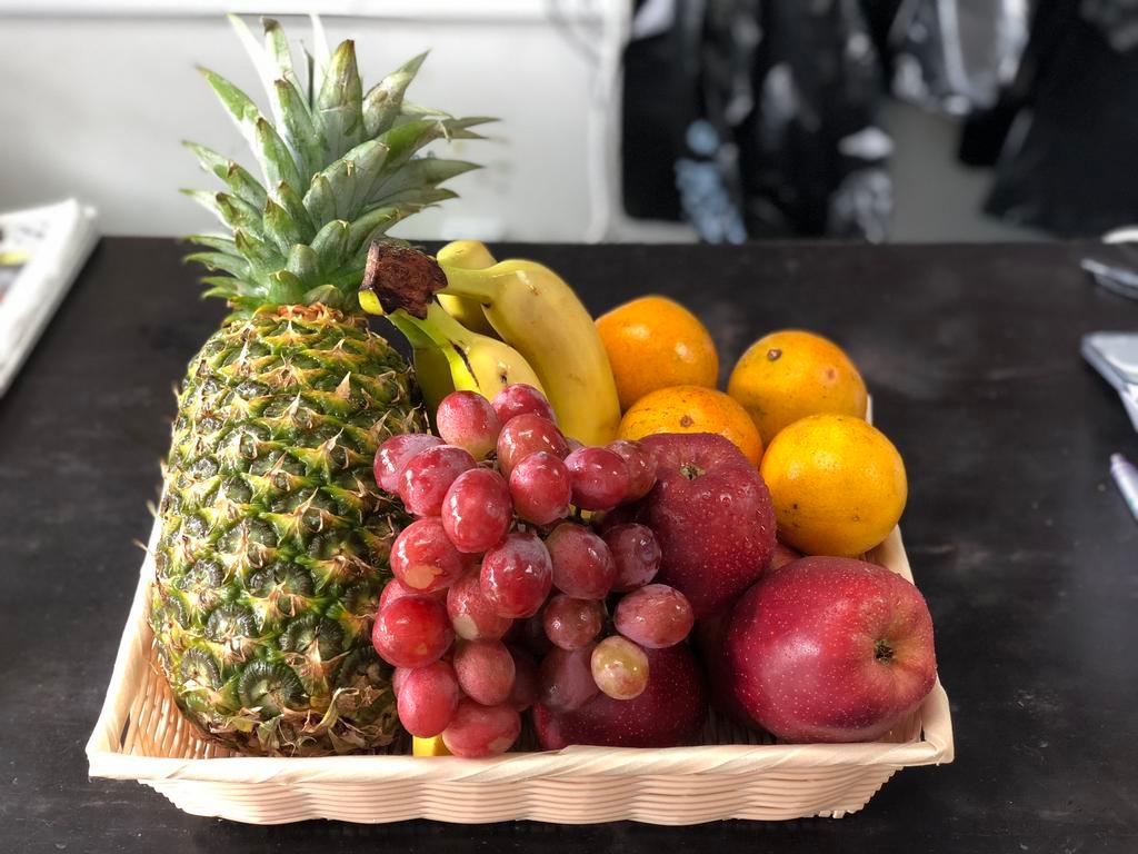 Basket 1 · 1 pineapple, 2 lb. bananas, 4 red apple, 1 lb. grapes, 6 oranges and 6 kiwis.