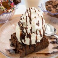 Brownie Sundae · Standard sundae. 1 warm brownie served with your choice of ice cream flavor topped with choc...