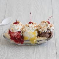 Banana Split · Traditional. 1 scoop each of chocolate vanilla and strawberry ice cream nestled between 2 ba...
