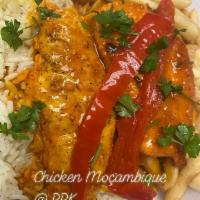 Chicken Mozambique · 2 chicken breasts topped with Mozambique sauce served with rice and fries. 