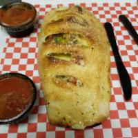 Italian Sausage Calzone Wrap · Papa Ray's pizza sauce, Italian sausage, onions, fresh mushrooms and green peppers wrapped i...
