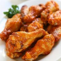 10 Piece Traditional Wings · Choose one flavor and one dipping sauce.