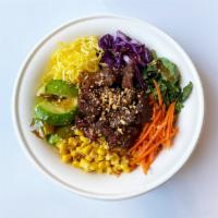The Rainbow Bibimbap · bulgogi. brown rice, red cabbage, carrot, corn, zucchini, kale, egg garnish, scallions, sesa...