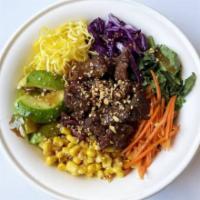The Rainbow Salad · bulgogi. mixed greens, red cabbage, carrot, corn, zucchini, kale, egg garnish, scallions, se...