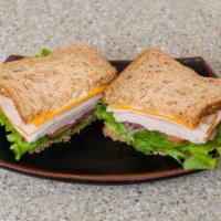 Turkey and Cheddar Lunch · Toasted multigrain bread with lettuce, tomato, onion and mayo.