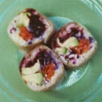 Coconut Roll · Coconut wrap laced with guacamole packed with vegetables such as beets, carrots, cucumber an...