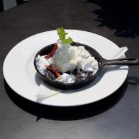 El Diablito · Dark chocolate and red pepper cookie served warm. Topped with vanilla ice cream, whipped cre...
