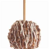 Pecan Bear Apple · Caramel-covered granny smith apple rolled in pecans, drizzled with milk chocolate and white ...