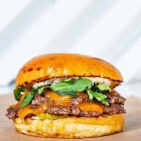 Swizz Stack · Our signature grass-fed beef double cheddar cheeseburger with arugula, shallot, dill pickle,...