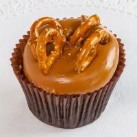 Caramel Crunch Cupcake · Chocolate cake with caramel frosting topped with sea salt and pretzels.