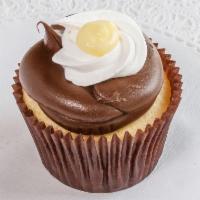 Boston Cream Pie  Cupcake · Vanilla cake, Bavarian filling with chocolate fudge frosting and a dollop of Bavarian on top.