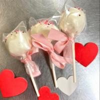 Valentine's Day Donut Hole Pops · Vanilla donut hole pops with white chocolate coating, valentine's day sprinkles. Individuall...