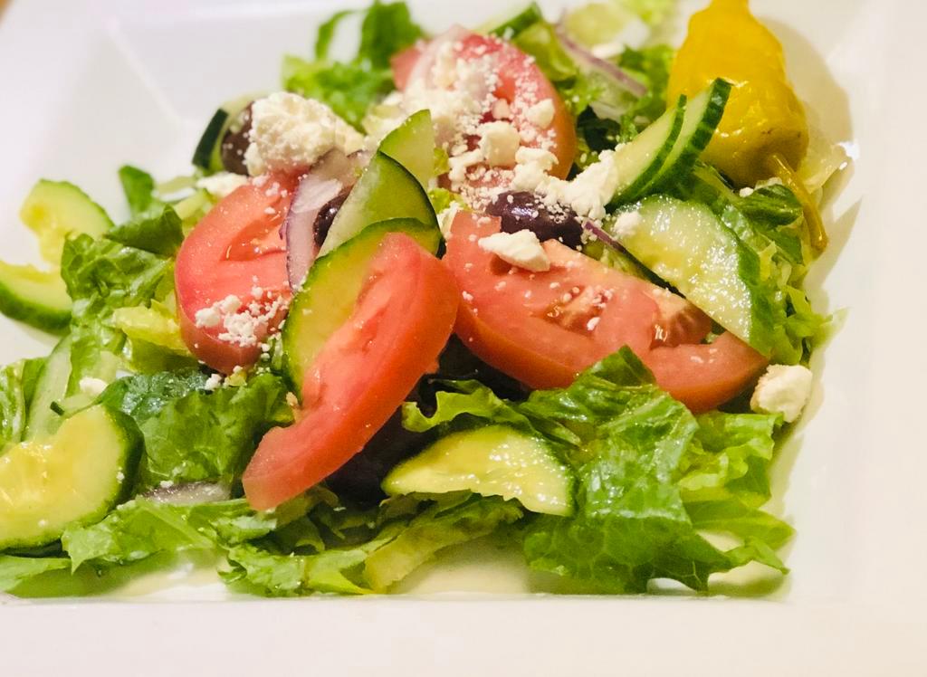 Greek Salad · Romaine Lettuce, Tomato, Red Onion, Cucumber, Feta Cheese, Kalamata Olive and Greek Vinaigrette Dressing.