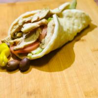 Spicy Chicken Gyro. · Cucumber, Red Onion, Tomato and Tzatziki Sauce Wrapped in Greek Pita.