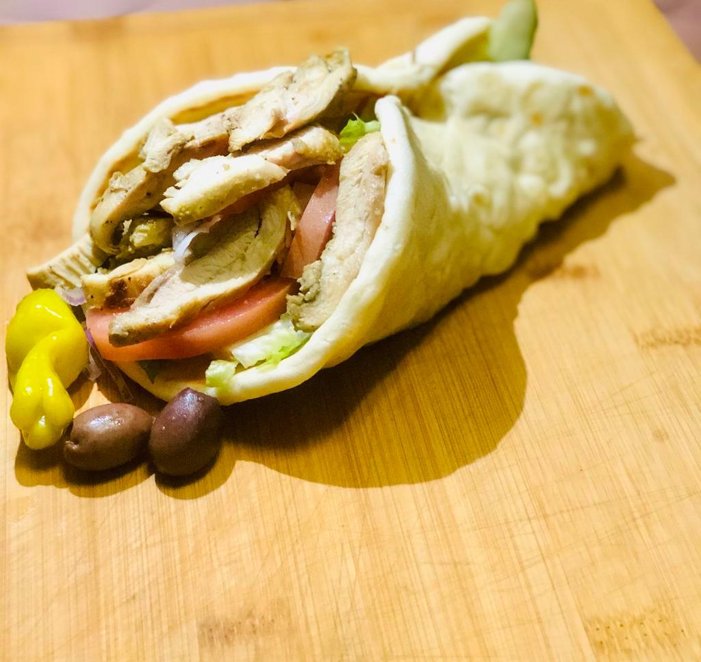 Chicken Gyro. ·  Cuccumber, Tomato, Onion and Tzatziki Sauce Wrapped in Greek Pita.