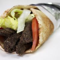 Beef Gyro. · Cucumber, Tomato, Onion and Tzatziki Sauce wrapped in Greek Pita.