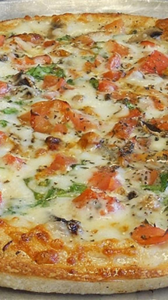 White Spinach Pizza · Mozzarella cheese, ricotta, spinach, fresh tomatoes, fresh garlic and olive oil.