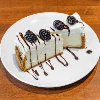 Seasonal Fruit Cheesecake · Rich creamy cake.
