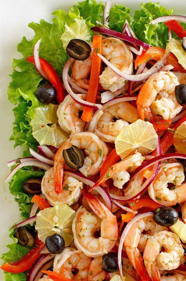 Shrimp Lemon-Pepper Shrimp Salad Bowl · Lemon pepper flavored shrimp, peppers, onions, on a bed of fresh green salad and drizzled with pineapple ranch salsa.