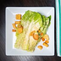 Caesar Salad · Romaine lettuce, shaved Parmiggiano, croutons, Caesar dressing.