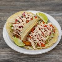 Fish Tacos · Flounder fillets. Battered and deep-fried, topped with cabbage, pico de gallo, and drizzled ...