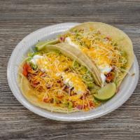 Veggie Tacos · Topped with refried beans, rice, fresh guacamole, sour cream, lettuce, cheese, and pico de g...