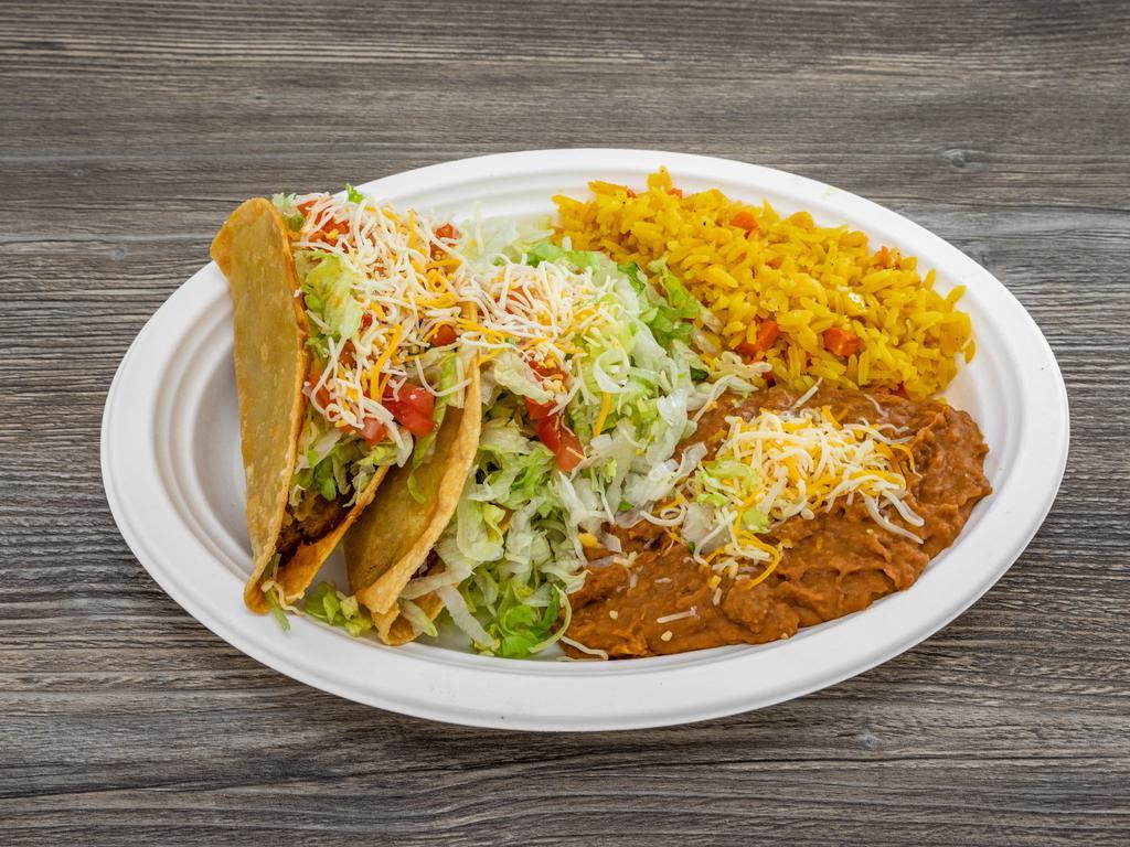 Shredded Beef Tacos · Tender beef brisket fried with corn tortilla shell then topped with lettuce, tomatoes, and cheese.	